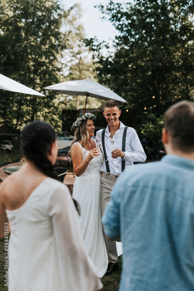 Happy bride and groom in garden, Sweden Happy bride and groom in garden, Sweden