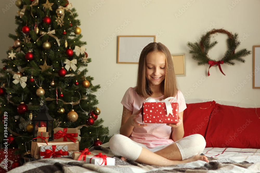 Cute little girl in the Christmas interior of the house Cute little girl in the Christmas interior of the house