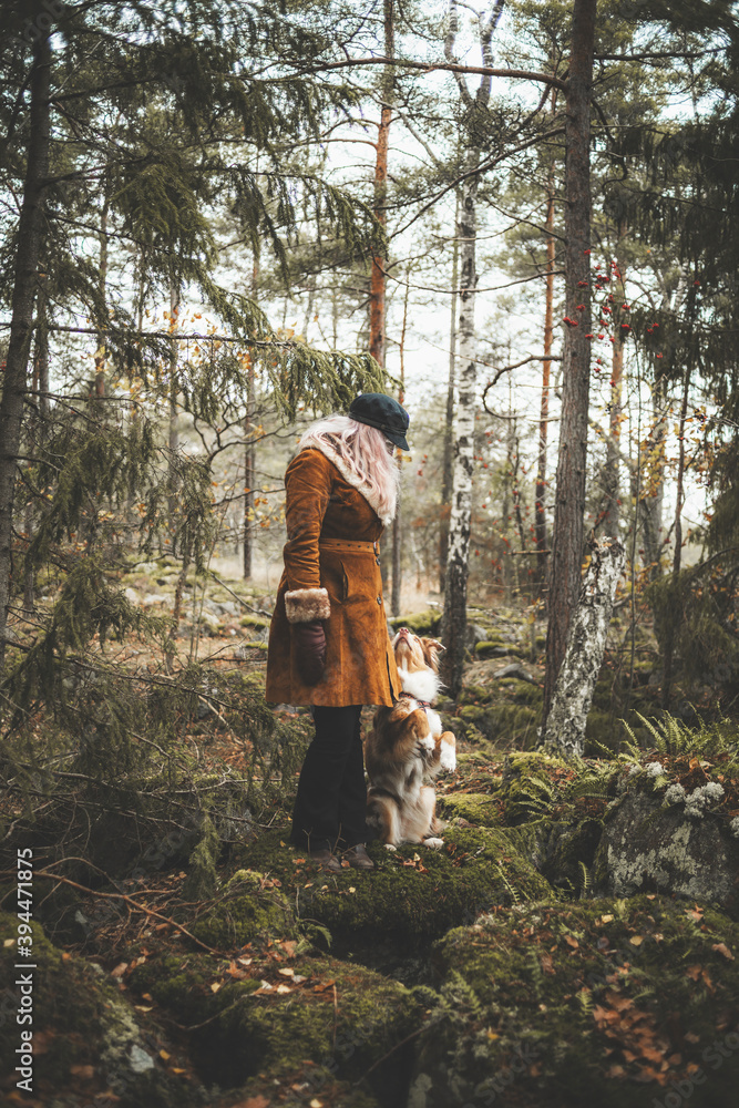 Woman with dog in forest, Sweden Woman with dog in forest, Sweden
