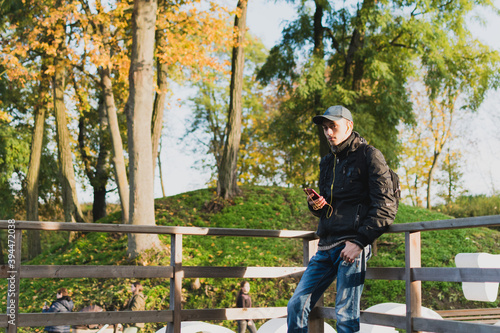 A young guy listens to music while traveling