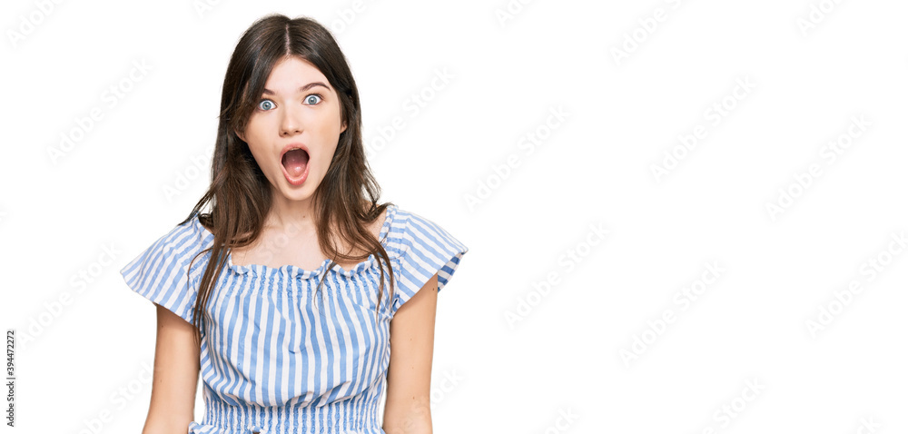 Young beautiful caucasian girl wearing casual clothes afraid and shocked with surprise and amazed expression, fear and excited face.