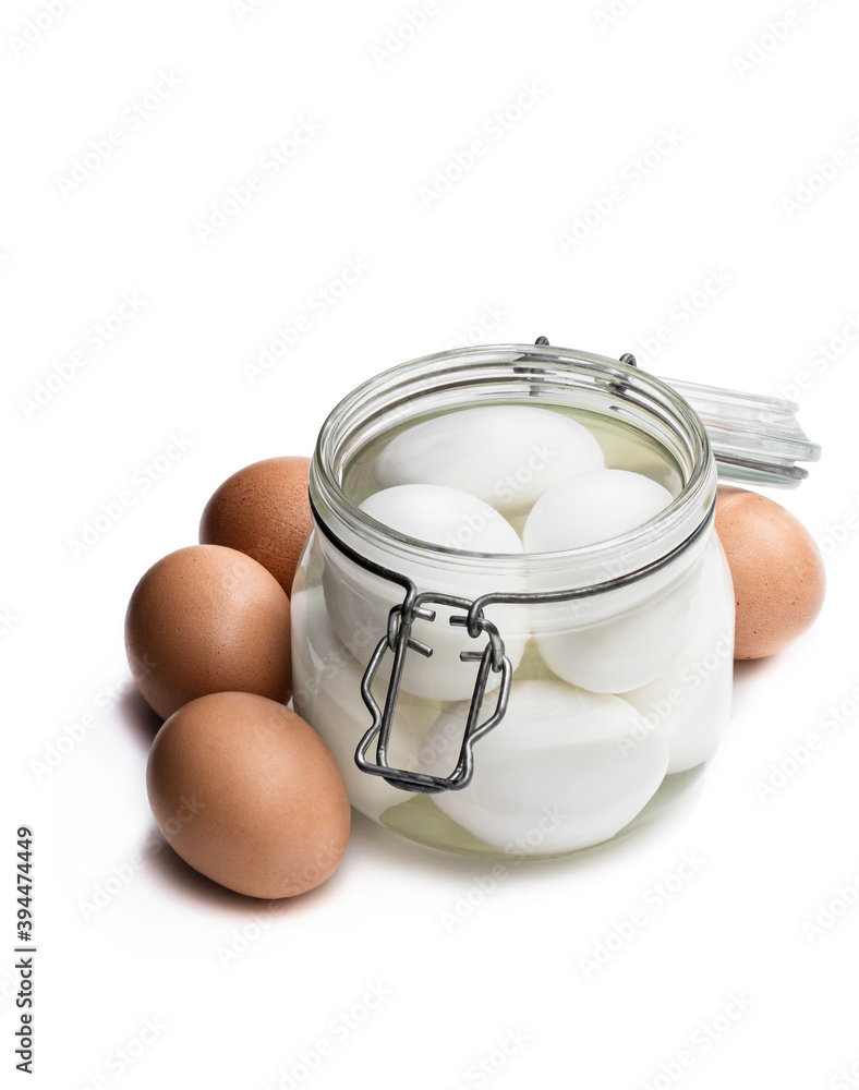 Pickled eggs in the glass jar isolated on white Pickled eggs in the glass jar isolated on white