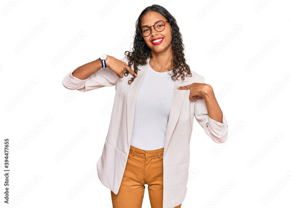 Young african american girl wearing business clothes looking confident with smile on face, pointing oneself with fingers proud and happy. Young african american girl wearing business clothes looking confident with smile on face, pointing oneself with fingers proud and happy.