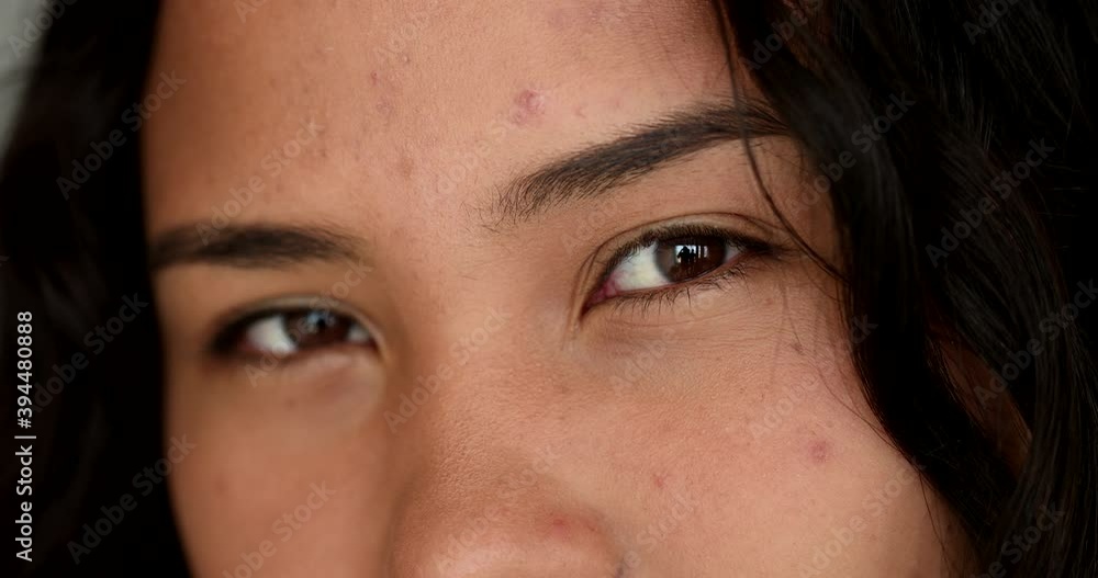 Macro close-up latina eyes sight looking at camera. casual real people series Macro close-up latina eyes sight looking at camera. casual real people series