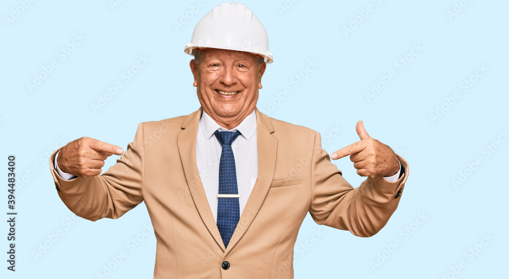 Senior caucasian man wearing architect hardhat looking confident with smile on face, pointing oneself with fingers proud and happy. Senior caucasian man wearing architect hardhat looking confident with smile on face, pointing oneself with fingers proud and happy.