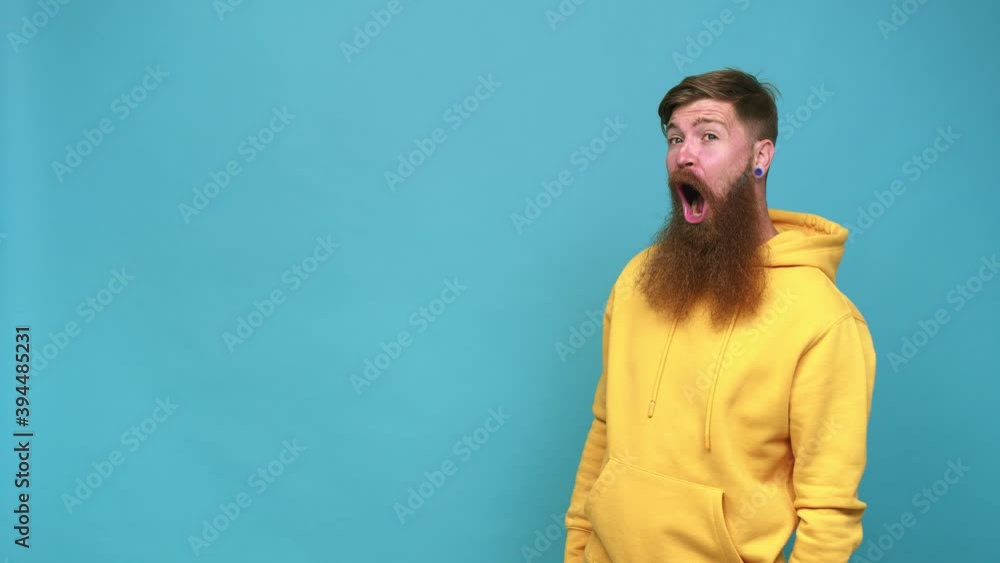 Young adult bearded caucasian man isolated being shocked because of something she has seen Young adult bearded caucasian man isolated being shocked because of something she has seen