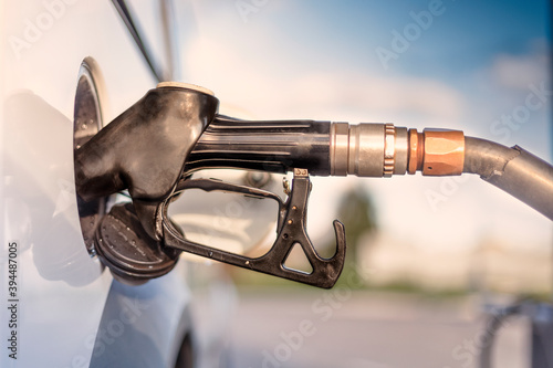 Φωτογραφία Refueling pistol in the neck of the tank, selective focus.