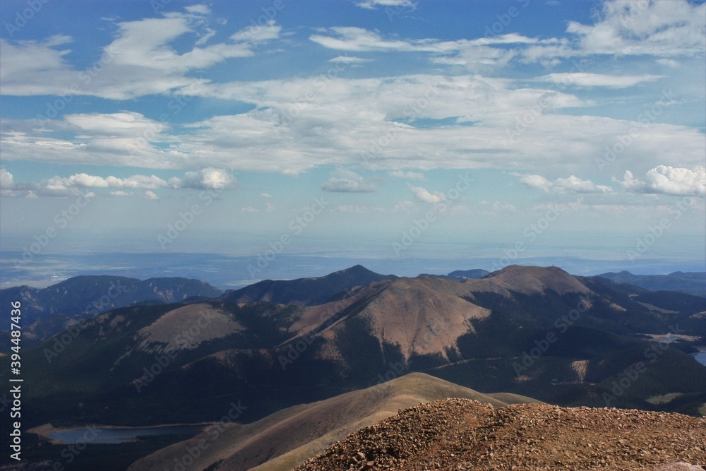 view from on top of Pikes Peak Colorado of a colorful sky and other Rocky Mountain's. By Colorado Springs Colorado.