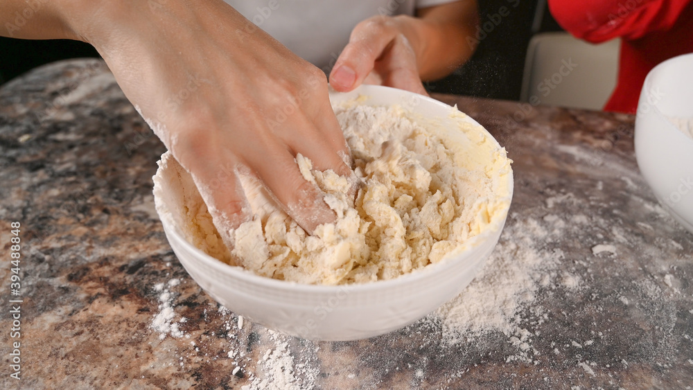 Fototapeta premium Knead the dough by hand