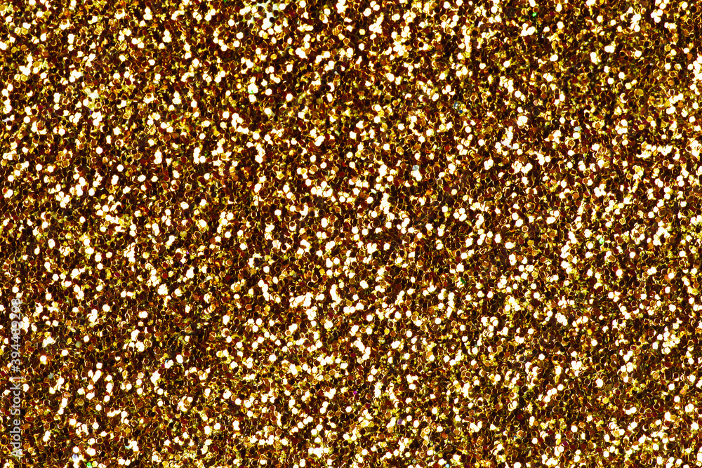 Yellow confetti background. Shiny grain texture. Glamour party effect pattern. Glowing noise glitter. Golden christmas glitter background.