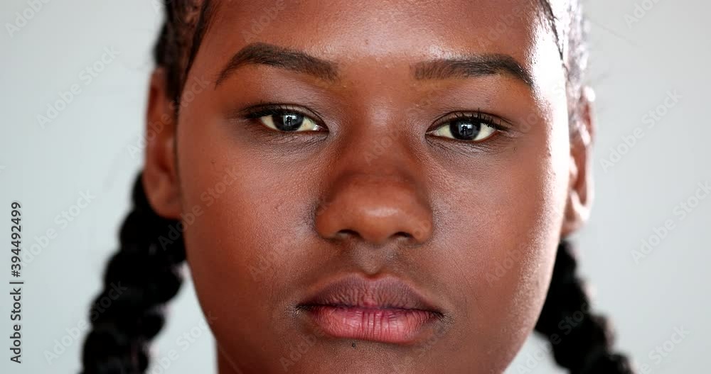 Mixed race girl changing emotion, young woman becoming serious and upset. African ethnicity Mixed race girl changing emotion, young woman becoming serious and upset. African ethnicity