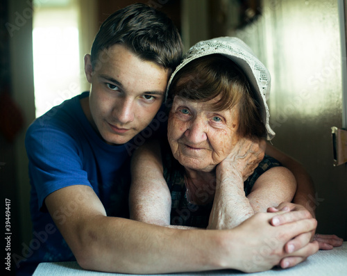 Portrait of a old woman grandmother and her grandson.