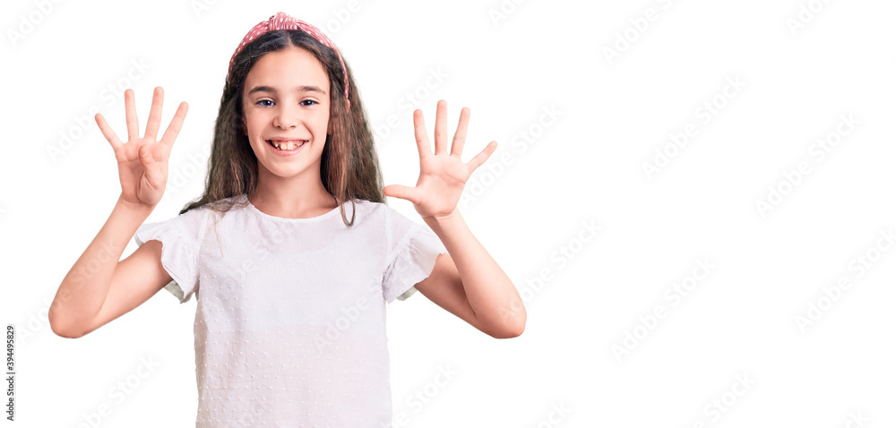 Cute hispanic child girl wearing casual white tshirt showing and pointing up with fingers number nine while smiling confident and happy. Cute hispanic child girl wearing casual white tshirt showing and pointing up with fingers number nine while smiling confident and happy.