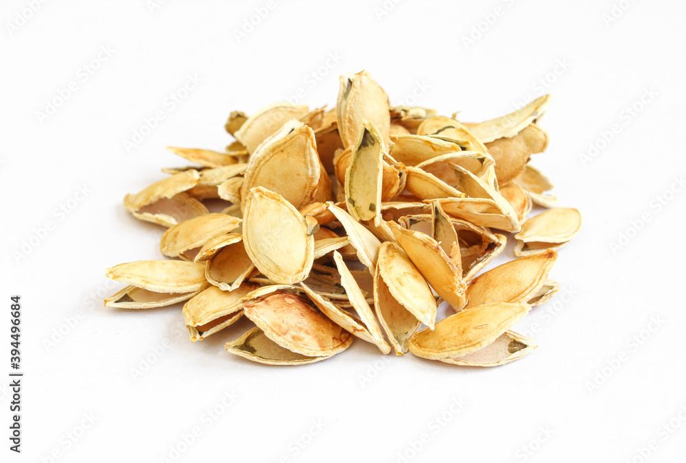 Pile of sunflower seeds isolated on white background. Stack of peeled skin