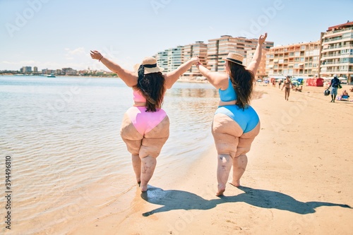 Wall Mural Two plus size overweight sisters twins women happy and proud of their bodies wal
