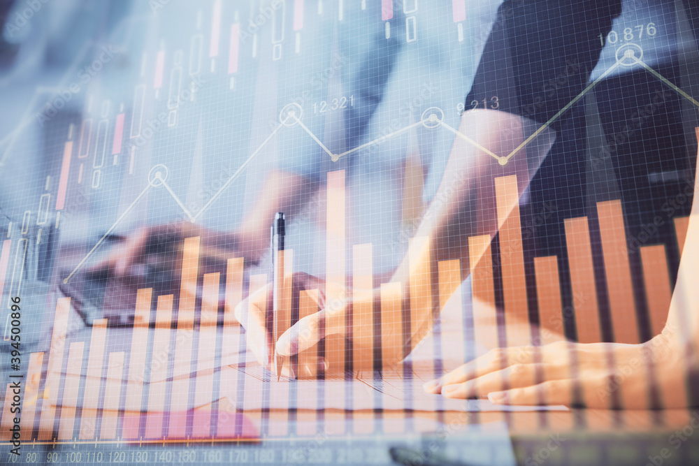 Multi exposure of woman hands typing on computer and financial chart hologram drawing. Stock market analysis concept. Multi exposure of woman hands typing on computer and financial chart hologram drawing. Stock market analysis concept.