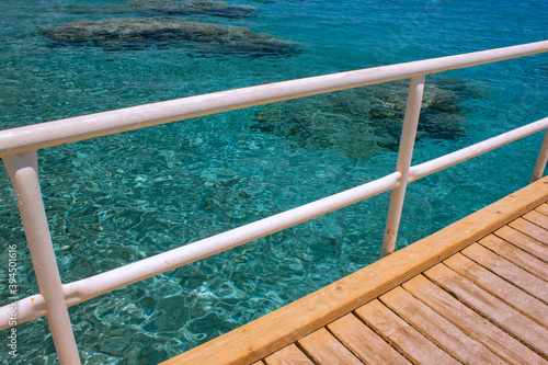 Red sea summer destination place clean water scenic view and wooden pier foreground © Артём Князь