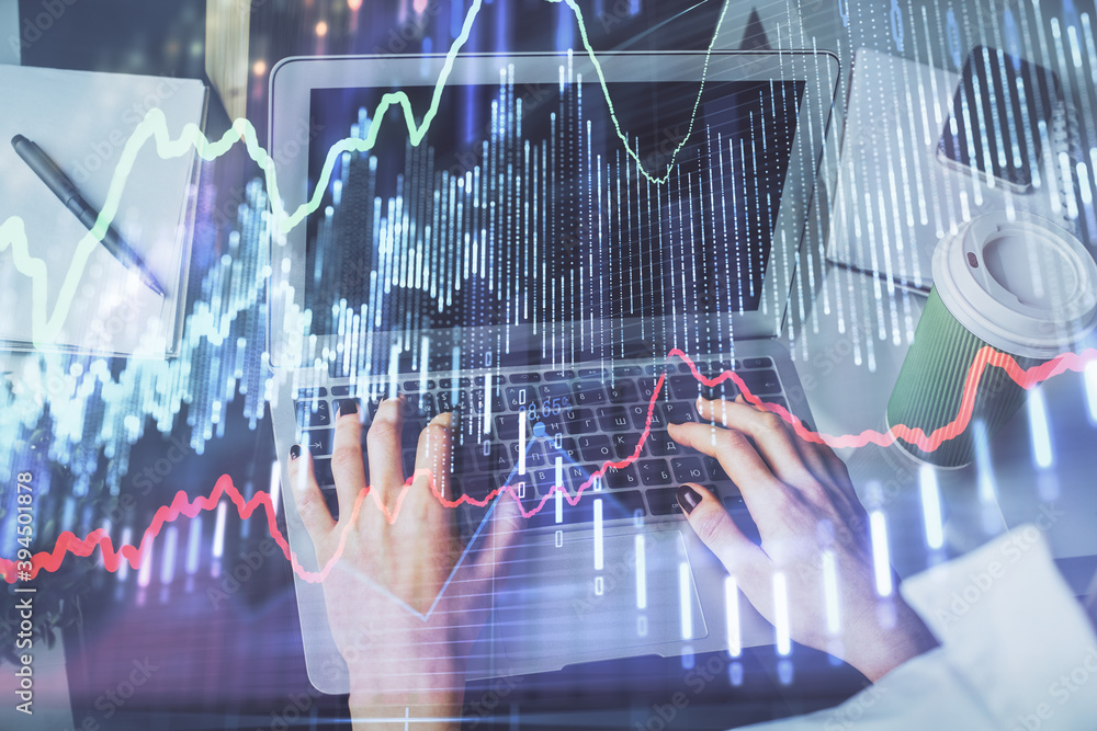 Double exposure of woman hands typing on computer and forex chart hologram drawing. Stock market invest concept. Double exposure of woman hands typing on computer and forex chart hologram drawing. Stock market invest concept.