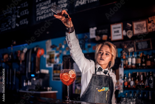 Girl bartender creates a cocktail in the saloon © Stop war in Ukraine!