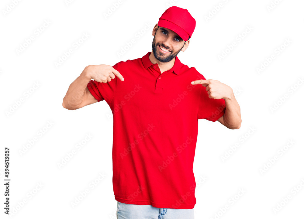 Young handsome man with beard wearing delivery uniform looking confident with smile on face, pointing oneself with fingers proud and happy. Young handsome man with beard wearing delivery uniform looking confident with smile on face, pointing oneself with fingers proud and happy.