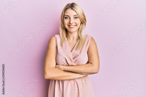 Young caucasian woman wearing casual clothes happy face smiling with crossed arms looking at the camera. positive person. © Krakenimages.com