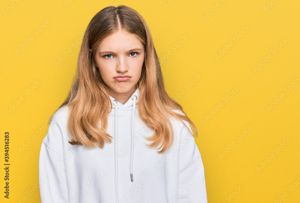Beautiful young caucasian girl wearing casual sweatshirt depressed and worry for distress, crying angry and afraid. sad expression. Beautiful young caucasian girl wearing casual sweatshirt depressed and worry for distress, crying angry and afraid. sad expression.