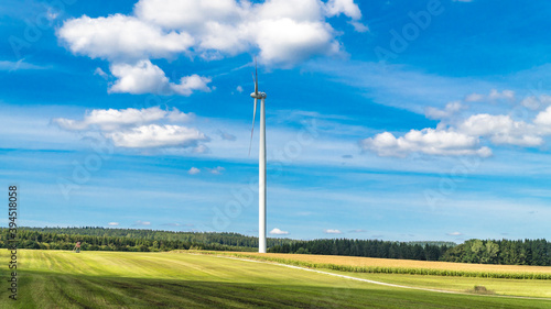Wind turbine surrounded by agricultural land