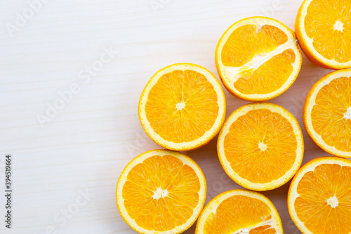 Sliced oranges on table background. High vitamin C  Juicy and sweet.