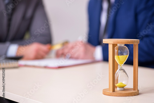 Two businessmen in time management concept