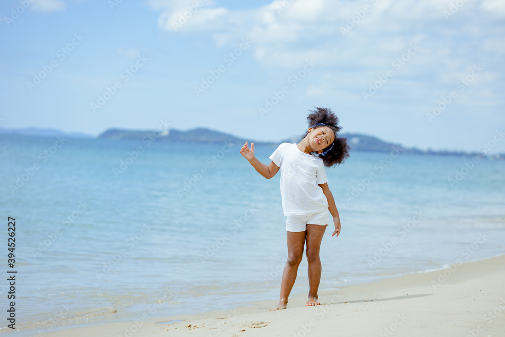Kid girl american african playing relax enjoy life funny moment on the beach Kid girl american african playing relax enjoy life funny moment on the beach