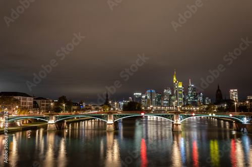 The Skyline of Frankfurt from the Ignatz-Bubis-Bridge at night.