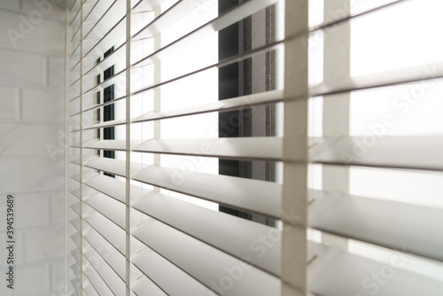 Close-up open venetian blinds. lighting range control sunlight coming from a window. decoration interior. Modern jalousie.