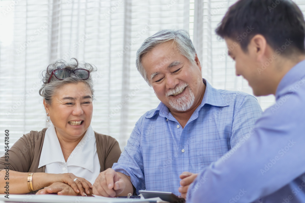 Happy retired Asian senior eldery couple consult with personal financial advisor or real estate agent. Retirement investment planning with professional counseling. Home loan and mortgage concept Happy retired Asian senior eldery couple consult with personal financial advisor or real estate agent. Retirement investment planning with professional counseling. Home loan and mortgage concept