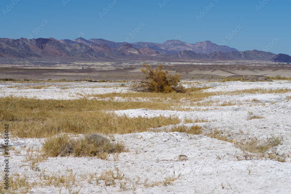 Dry soda, badlands, and mountain range in Tecopa, located in Inyo County, California. Tecopa is known for it's hot springs.