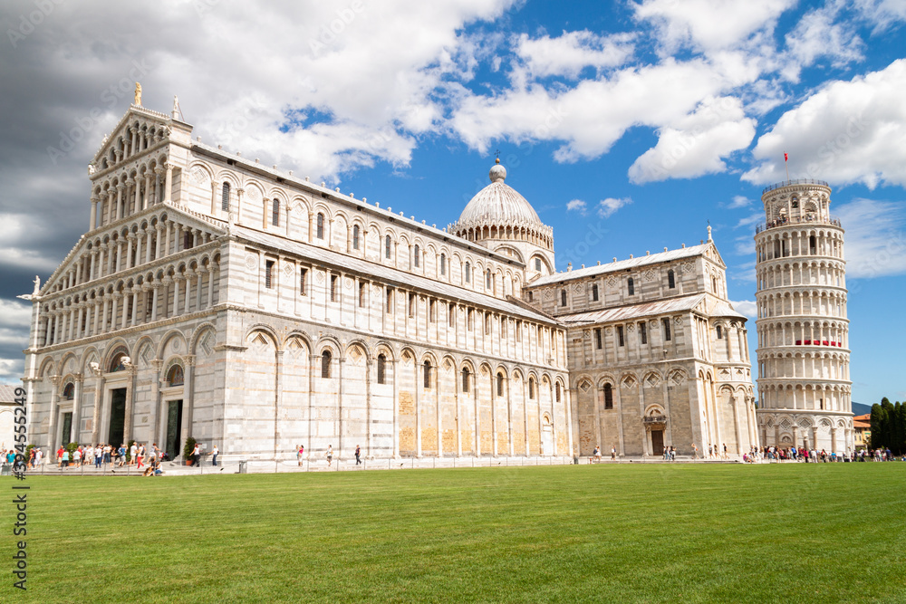 Pisa cathedral and the leaning tower in sunny day, Italy vacation