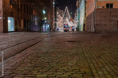 Helsinki, Finland November 22, 2020 Aleksanterinkatu street is decorated for Christmas. Photo at night. Long exposure. photo