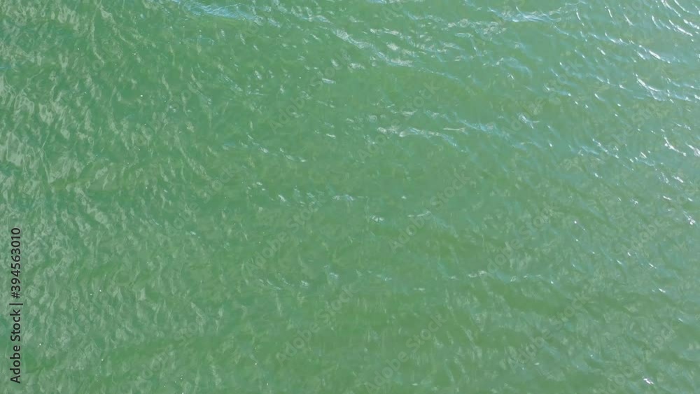 Top view, aerial view of the lake with pattern wave. Stock footage of blue color deep lake water. Soft blue water wave, turquoise waves, clear water surface. Nature surface background texture design Top view, aerial view of the lake with pattern wave. Stock footage of blue color deep lake water. Soft blue water wave, turquoise waves, clear water surface. Nature surface background texture design