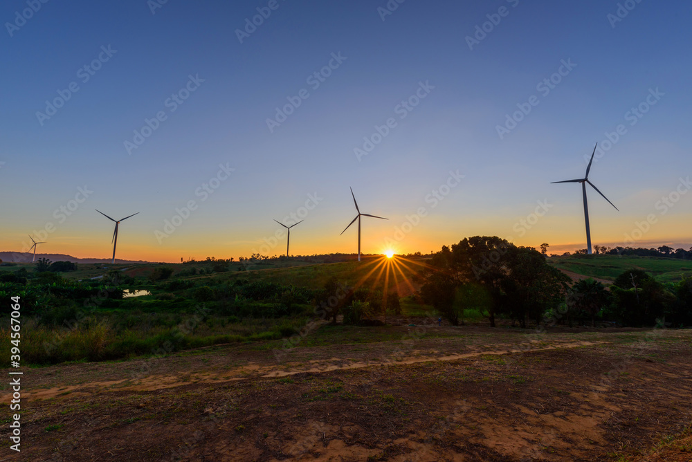 wind turbines park for make the electric power from wind in sunset time wind turbines park for make the electric power from wind in sunset time
