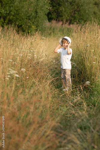 Happy boy in meadow in summer © Elena Odareeva