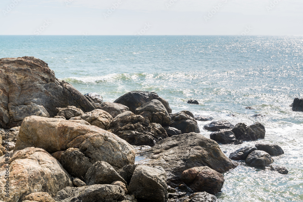 Seascape of waves splashing the stones in the rocky coastline of Yangxi, Yangjiang of China Seascape of waves splashing the stones in the rocky coastline of Yangxi, Yangjiang of China