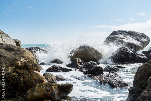 Seascape of waves splashing the stones in the rocky coastline of Yangxi, Yangjiang of China