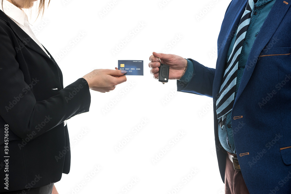 buying or renting a car. businessmen isolated on white holding credit card and keys buying or renting a car. businessmen isolated on white holding credit card and keys