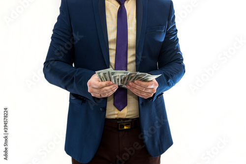Businessman counts money isolated on white. A man in a suit is making a profit or a win. Account of dollars. Wealth concept.