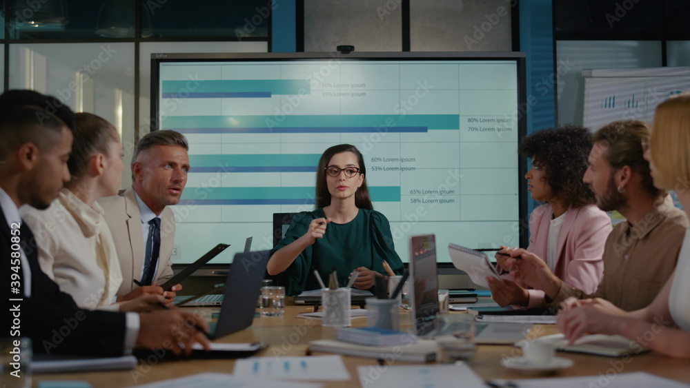 Top manager female discussing strategy with team. People talking about startup Top manager female discussing strategy with team. People talking about startup