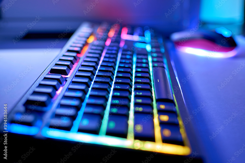 Gaming keyboard with RGB led light. Blurred background, bokeh. Stock Photo  | Adobe Stock