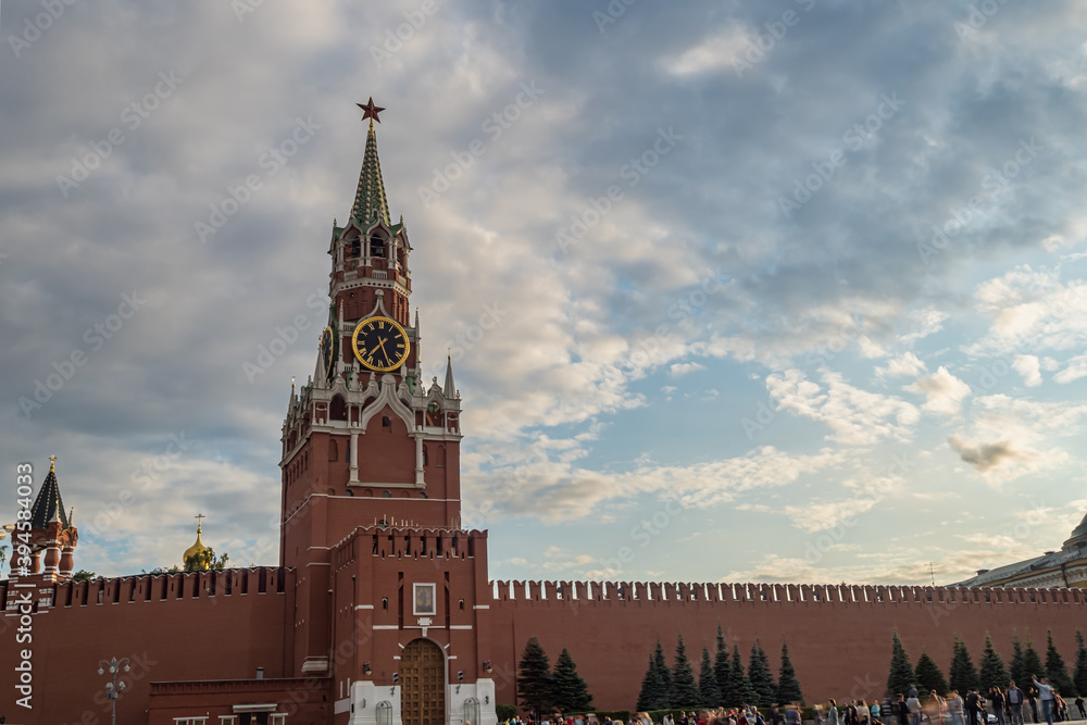 Moscow Kremlin, Red Square. Spasskaya Savior's clock tower in front of storm cloudy sky.