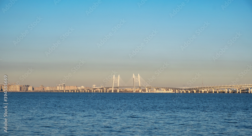 Panorama of the Gulf of Finland overlooking the city and a modern road bridge in St. Petersburg, Russia.