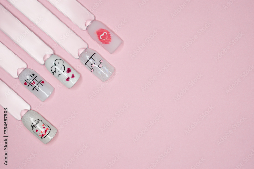Valentin day nail picture . flat lay with copy space on pink bachground . beauty salon concept . Valentin day nail picture . flat lay with copy space on pink bachground . beauty salon concept .