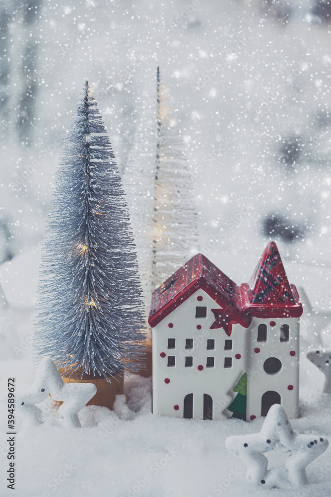 Christmas composition. Christmas trees and a Christmas house in a snowy forest. Christmas, winter, new year concept.