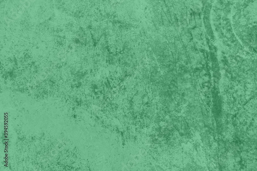 Trendy mint colored low contrast Concrete textured background with roughness and irregularities to your design or product. 2021 color trend concept. Urban modern design. Home decor. 